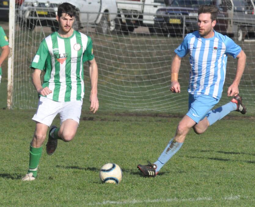 ON THE CHASE: Waratah FC's Adam Kelly looks to regain possession from Grant Koch in his side's 3-2 win over Barnstoneworth FC on Saturday. Photo: SUPPLIED 