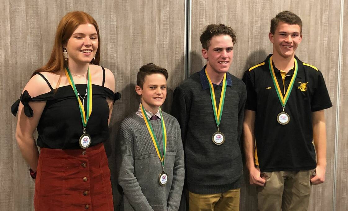 TIGERS WINNERS: Gemma Gailey, Nate and Liam Constance and junior umpire of the year Dominic Gibson. Photo: SUPPLIED. 