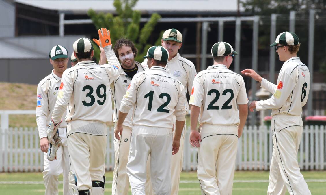 HAPPY AS LARRY: Orange City celebrate a Brett Causer wicket as they secure a first-innings win over City Colts on Saturday. Photo: JUDE KEOGH