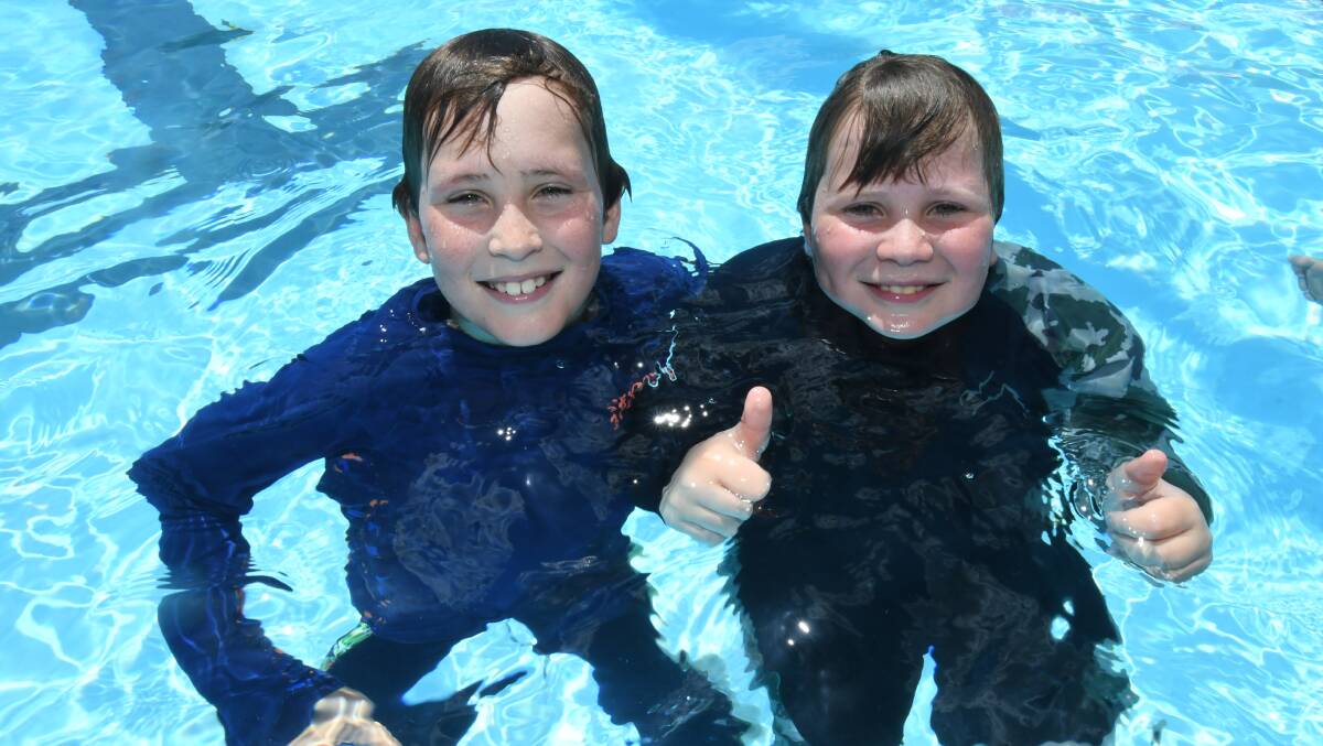 THUMBS UP: Finn and Oscar O'Byrne having a splash at the Orange Aquatic Centre. Photo: JUDE KEOGH.