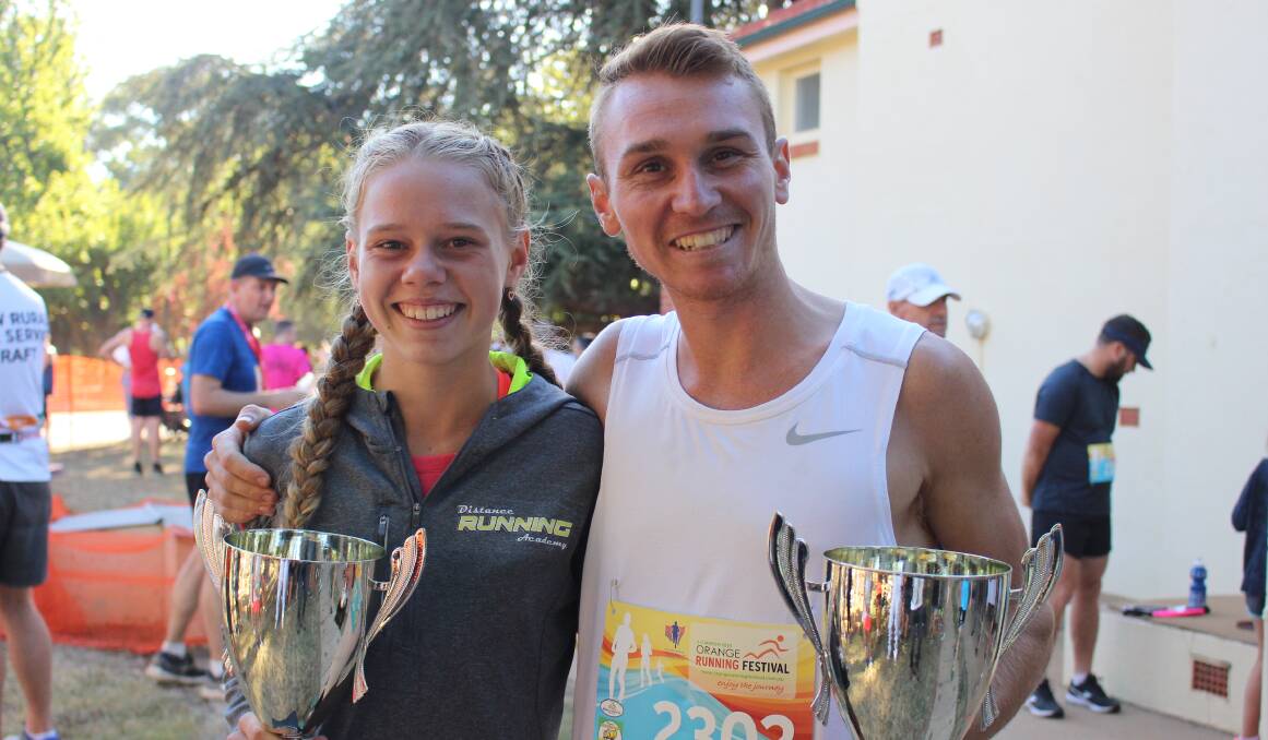 DOUBLE TROUBLE: Steph and Josh Torley with their silverware from taking out their respective half marathon events. Photo: MAX STAINKAMPH