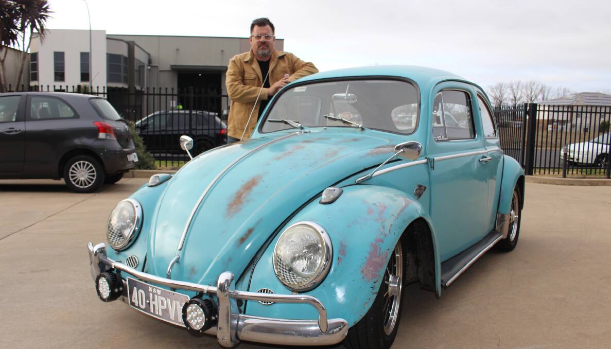BYE BYE BEETLE: Bill Parianos with his beloved Volkswagen Beetle, a car with a cult following both in Orange and worldwide. Production of the cars finished this week. Photo: MAX STAINKAMPH. 