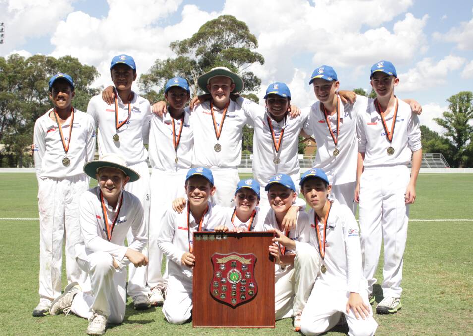 WINNERS ARE GRINNERS: ACT Blue were very happy to have their hands on the trophy as the victors in the Under 13 Western NSW Junior Cricket Carnival. Photo: MAX STAINKAMPH