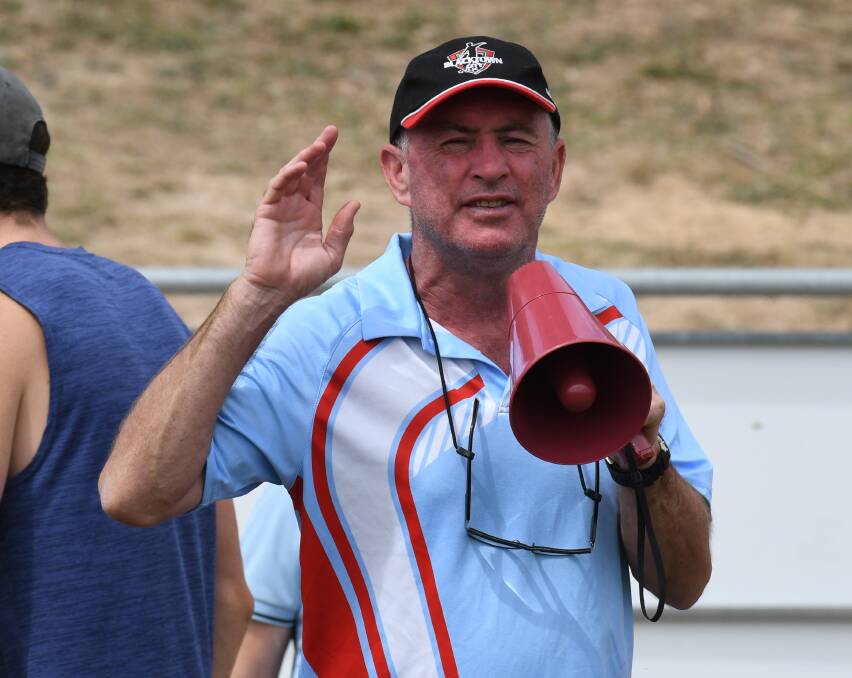 Paul Wade on the megaphone during the seniors' tournament. Photo: JUDE KEOGH