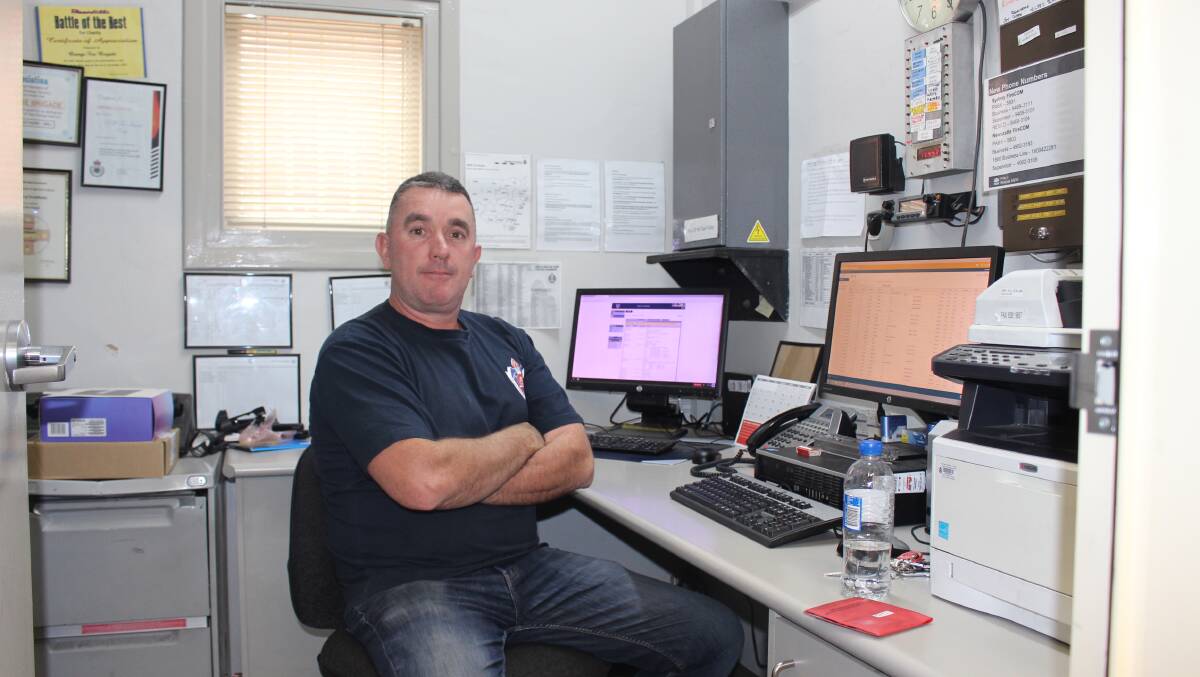 NSW Fire and Rescue retained firefighter Chris Dickerson in the office at the NSW Fire and Rescue station in Orange. Photo: MAX STAINKAMPH