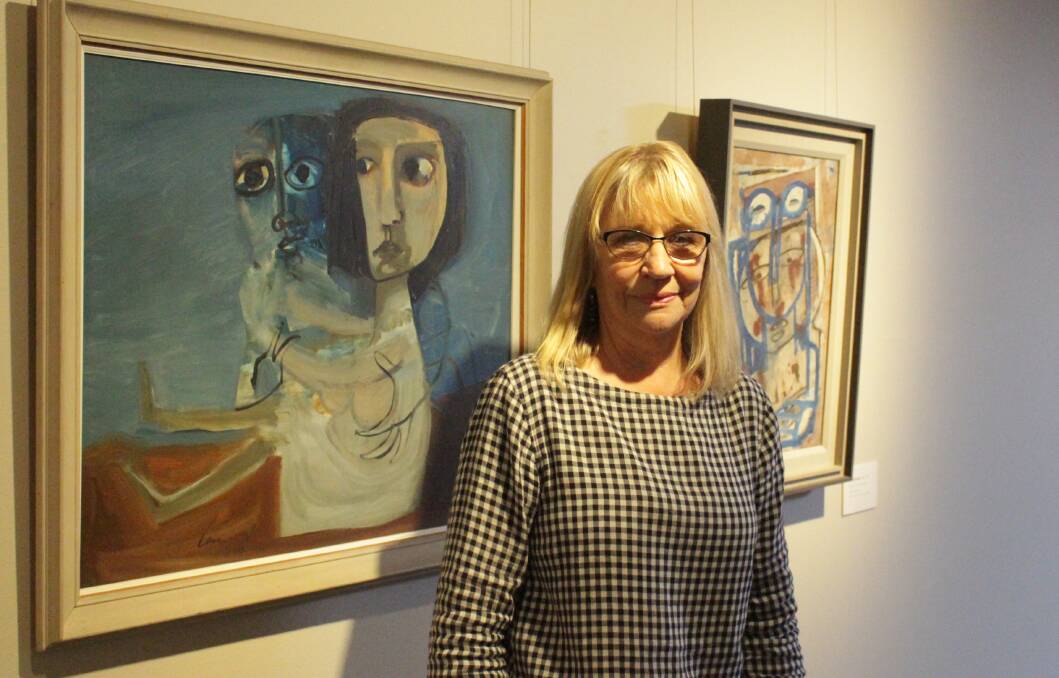 GOODBYE, OLD FRIENDS: Orange Regional Gallery assistant director Brenda Gray in front of some old friends - some of her favourite Mary Turner paintings upstairs in the gallery. Photo: MAX STAINKAMPH