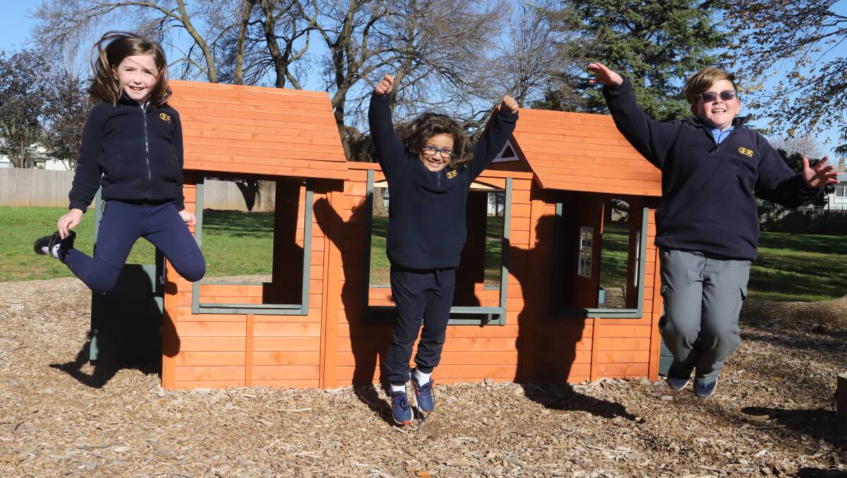 JUMPING FOR JOY: Orange East Public School students Lilyanah Burton, Micaela Rapley and Tyson Morris in the playground on Monday. Photo: CARLA FREEDMAN