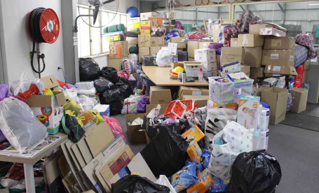 GENEROSITY PILED HIGH: The donations at the Orange Tennis Centre on Friday. Photo: MAX STAINKAMPH