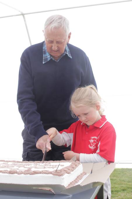 Cake cutting with the oldest former student Brian Baker and the youngest current student Clara Hutchinson. Photo: MAX STAINKAMPH