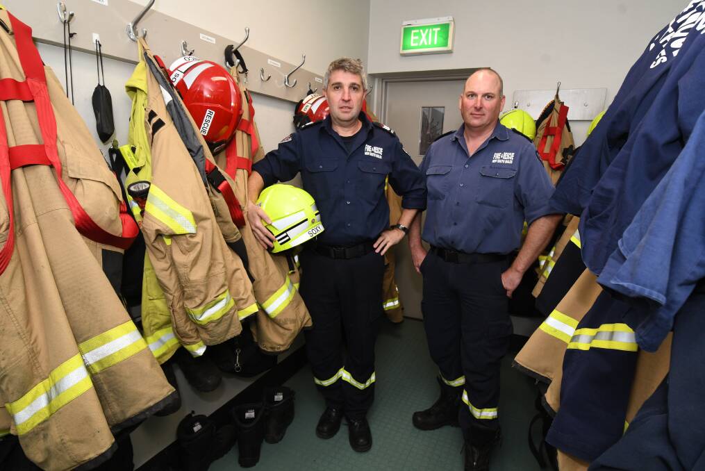 OVER IT: NSW Fire and Rescue firefighters Tim Collins and Dave Beattie at the fire station in Orange. They've attended at least 20 car fires this year alone and are "frustrated" by the problem. Photo: JUDE KEOGH