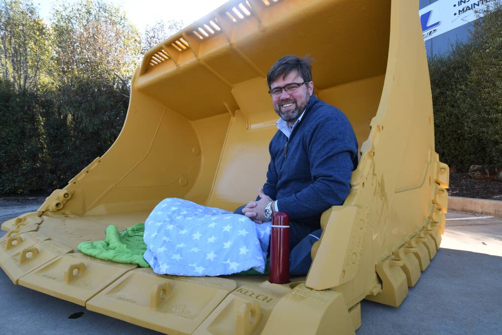 SLEEPING OUT: PJL CEO Ben Farrands in the steel bucket he'll be sleeping in on Thursday night to raise awareness for homelessness. Photo: JUDE KEOGH