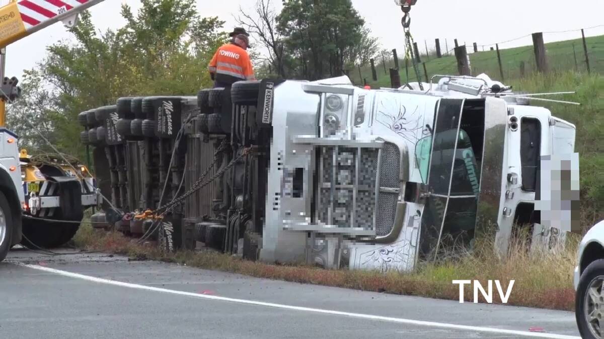 ROLLOVER: The truck on the section of the Mitchell Highway. Photo: TROY PEARSON/TOP NOTCH VIDEO