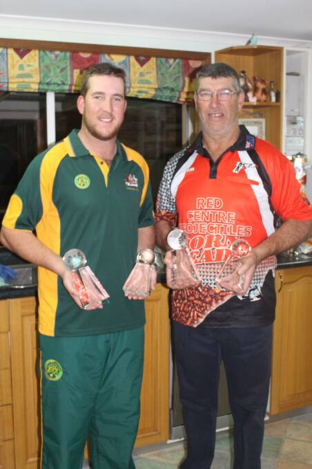 FATHER AND SON: Pete and Dean Brus show off their trophies from Bowral. Photo: MAX STAINKAMPH