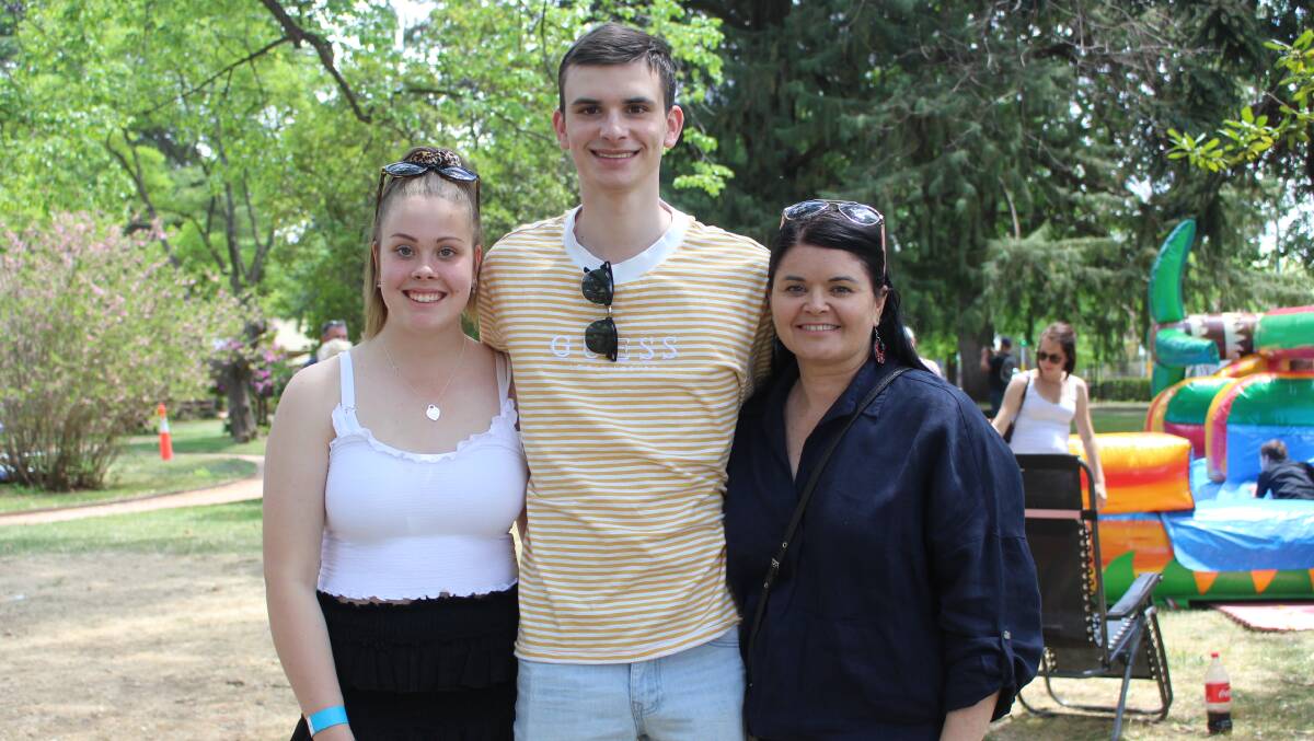 GIVEN A LEG UP: Cooper Tarleton (centre) with his girlfriend Ash Rubsov and mother Kylie at Cook Park on Saturday. Photo: MAX STAINKAMPH
