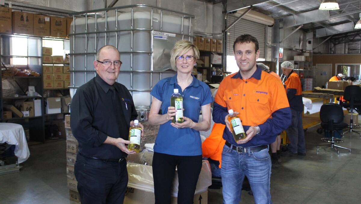 PRODUCTION LINE: Kevin McGuire, Cargill's Karen Brownlee and Keiran Taylor on the Wangarang factory floor. Photo: MAX STAINKAMPH