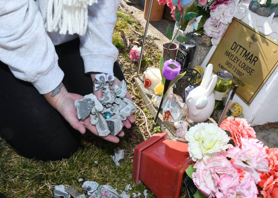 DAMAGE DONE: The smashed mementos at Julie Dittmar’s daughter's graveside. Photo: CARLA FREEDMAN