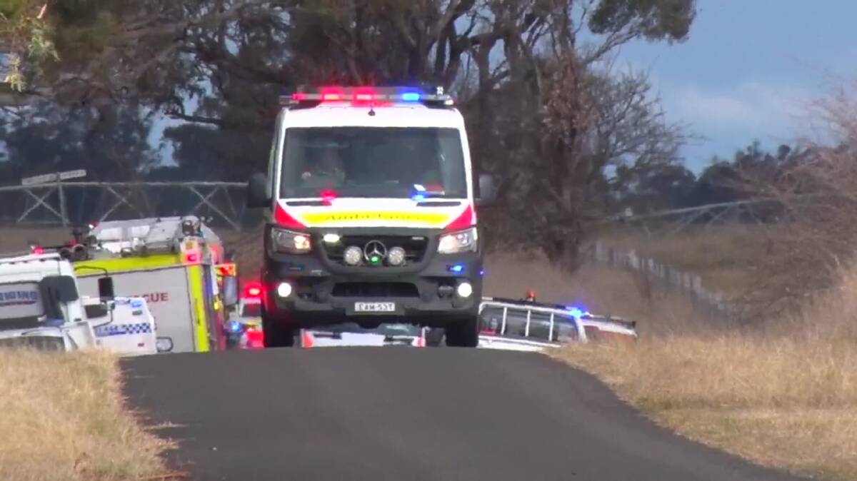 SERIOUS CONDITION: An ambulance takes the man involved in a single-vehicle crash to Orange hospital, before he was flown to Newcastle. Photo: TROY PEARSON/Top Notch Video