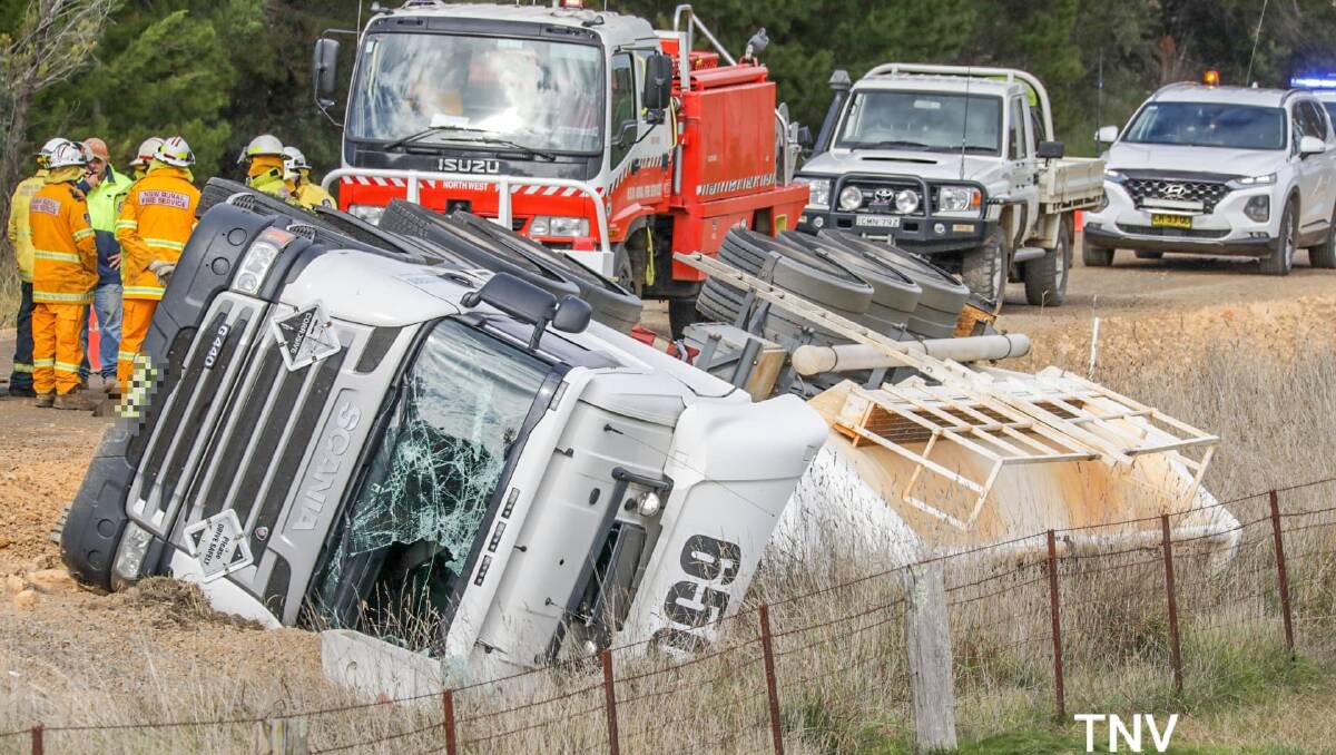 A truck carrying industrial chemicals has rolled on Burrendong Way. Photos: TROY PEARSON/TOP NOTCH VIDEO