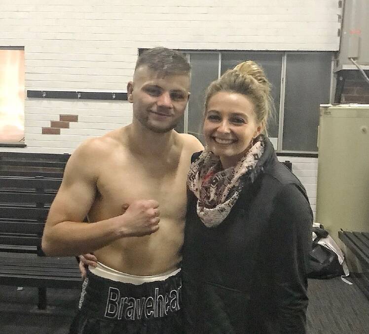 TOP OF THE WORLD: Jack Littlefield with girlfriend Emerson Miller straight after his fight at Towac Park, where he said is 'the happiest I ever feel'. Littlefield nearly didn't have a fight on Saturday. Photo: SUPPLIED.