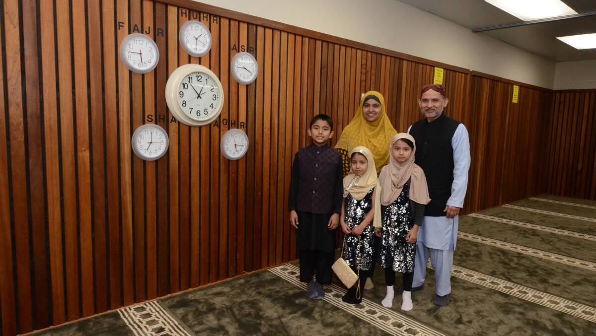 DIFFERENT RAMADAN: Ibraham, Sarah and Maryam (front) with Sadaf and Khalid Tufail at the Peisley Street mosque. They've had a very different Ramadan to normal in 2020. Photo: JUDE KEOGH