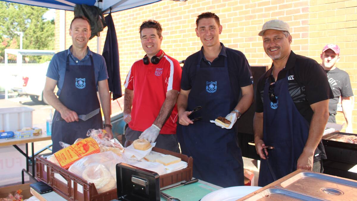 FEEDING THE BEAST: Matt Fuller, Warwick Baines, Antony Spruce and Toby Te Rupe in charge at Bletchington Public School. Photo: MAX STAINKAMPH