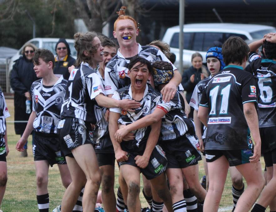 JUBILATION: Cowra's juniors after the final buzzer in the 2018 grand final. Celebrating in 2020 will be far different. Photo: NICK McGRATH