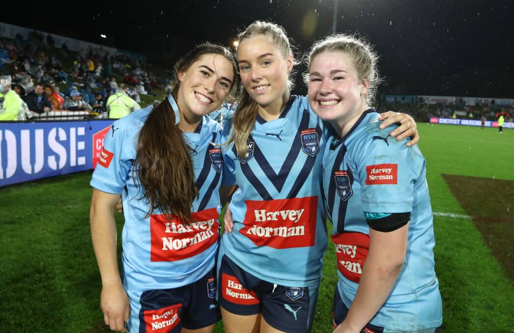 Teagan Berry (centre) and Lilly Baker (right) after the NSW under 19s side's win in Queensland on Friday. Photo: NRL Imagery