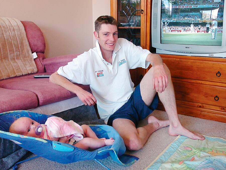 Orange City all-rounder Shaun Grenfell watching The Ashes with his daughter Kaylee ahead of the final day of the Bathurst Orange Inter District Cricket game against Bowen Centrals in 2006. Picture by Steve Gosch