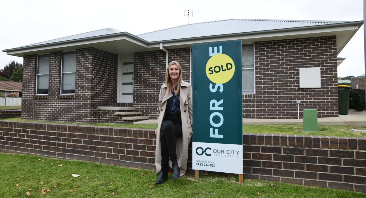 Ash Bock from Our City Real Estate outside a recently sold Wakeford Street unit. Picture by Carla Freedman
