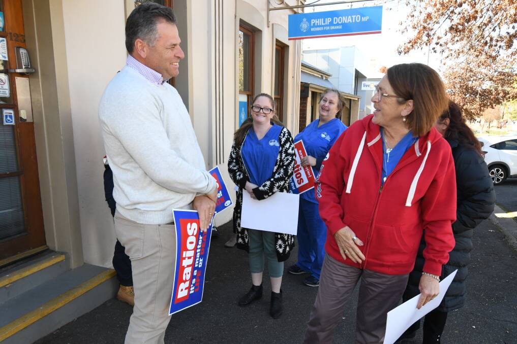 CHANGE: Phil Donato chatting with Tracey Coyte outside his office. Photo: JUDE KEOGH.