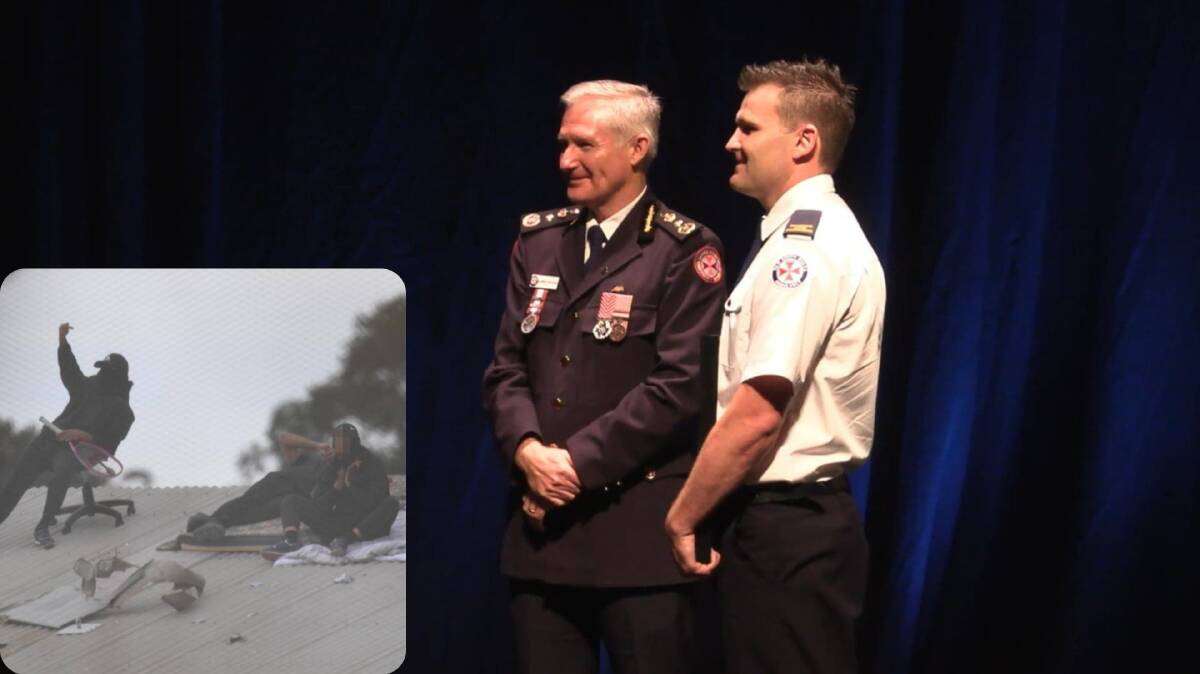 WELL-DESERVED: Luke Kelly receives the Commissioner's Unit Citation - Courage from NSW Ambulance Commissioner Dr Dominic Morgan ASM for his work during the riot at the Kariong Juvenile Justice Centre.