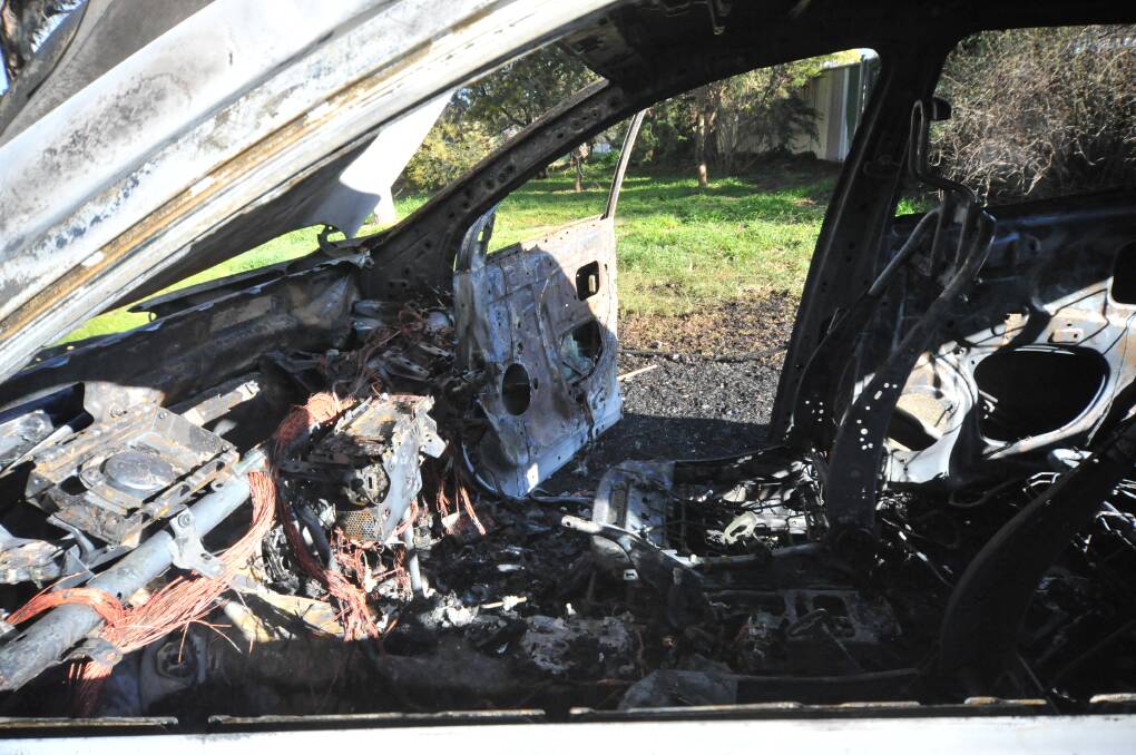 DESTROYED: The inside of the car that was set on fire in Edye Park on Monday morning. Photo: CARLA FREEDMAN