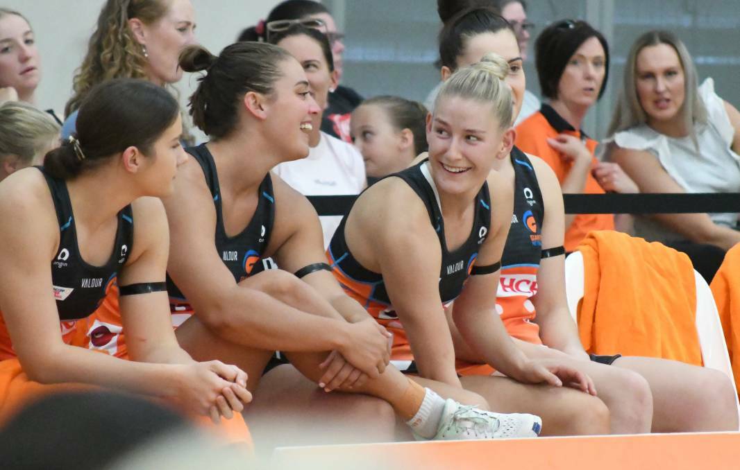 DELIGHTED: Annie Miller on the bench for Giants Netball just before making her debut in front of her home crowd earlier this year. Photo: JUDE KEOGH.