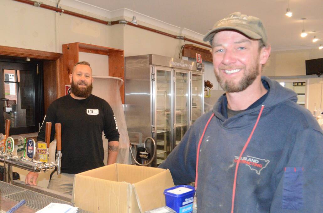 BJ Barrett and Josh Quilty were hard at work back in October to get the Great Western Hotel ready to open. Picture by Riley Krause.