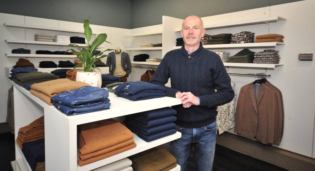 WELL DONE: Chris Peisley and his Hartfords Menswear store are up and running after a fire caused its closure two months ago. Photo: JUDE KEOGH