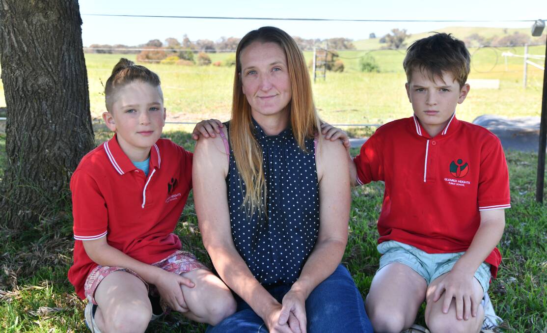 Dax, Rachel and Mason Clarke were all left devestated following a fire at Glenroi heights Public School. Picture by Carla Freedman.