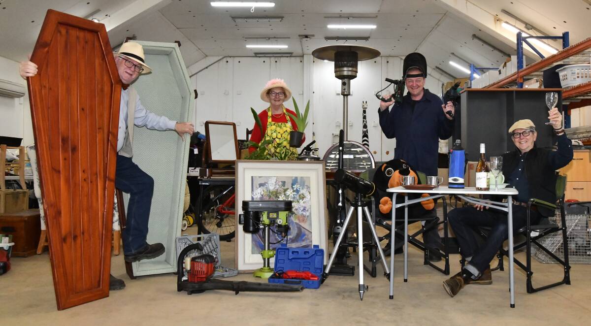 Graeme Fleming, Chris Miller, Steve Kay, Stuart Smith hard at work getting things ready for Orange's Biggest Garage Sale. Picture by Carla Freedman.
