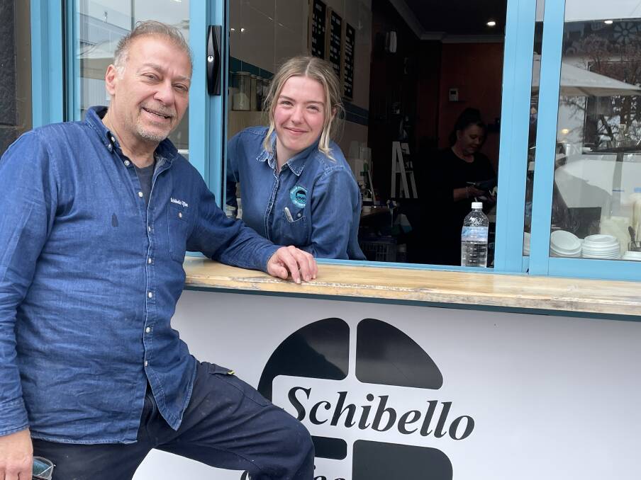 NOT GOING ANYWHERE: Cremas Arthur Aube and head barista Elle Curran-Neist at the popular cafes service window. Photo: KATE BOWYER