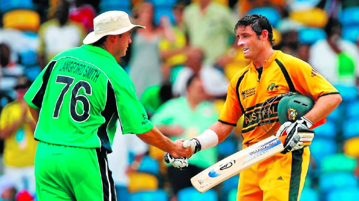 Bowen Centrals junior David Langford-Smith shakes the hand of retiring Australian batsman Mike Hussey in the ICC Cricket World Cup Super Eights match between Australia and Ireland at the Kensington Oval on April 13, 2007 in Bridgetown, Barbados.
