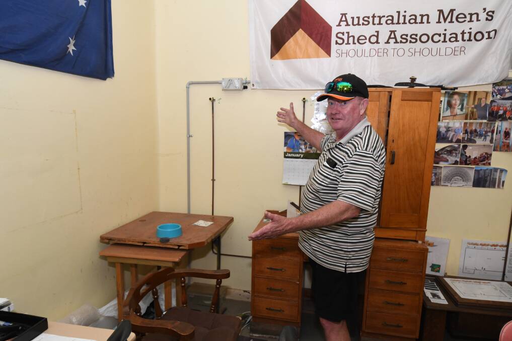 FRUSTRATED: John Shepherd pointing out where the TV used to be. Photo: JUDE KEOGH.