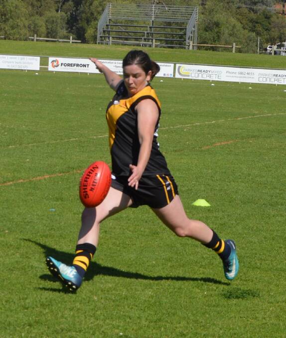 GOOD HIT OUT: Jade Charnock in action for the Orange Tigers during Sunday's AFL Central West season launch in Parkes. Photo: KRISTY WILLIAMS.