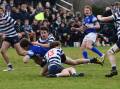 TROUBLE: It was an action-packed game between Kinross and Stannies. Photo: JUDE KEOGH.