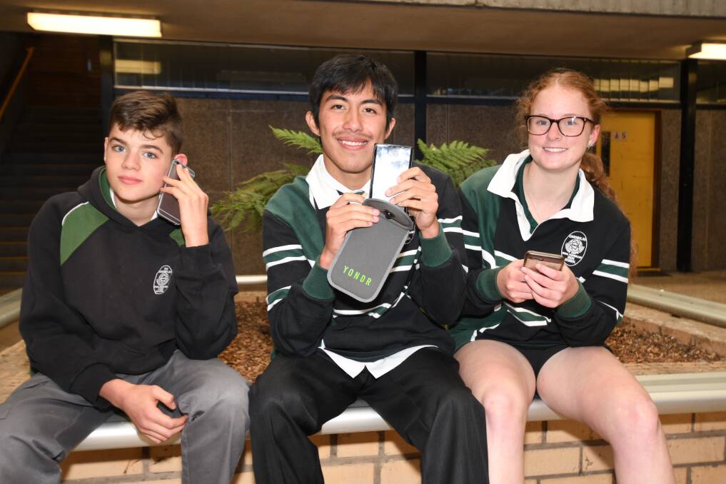 WAY FORWARD: Lachlan Crossman, Blair Bella and Montanna Mcilwain could be using the Yondr pouches by next term. Photo: CARLA FREEDMAN.
