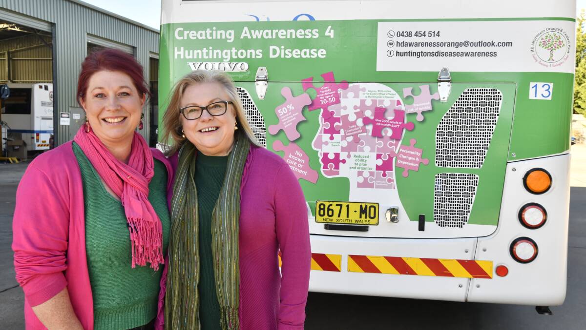Rachael Brooking and Natalia Rossiter with the bus creating awareness for Huntington's disese. Picture by Carla Freedman