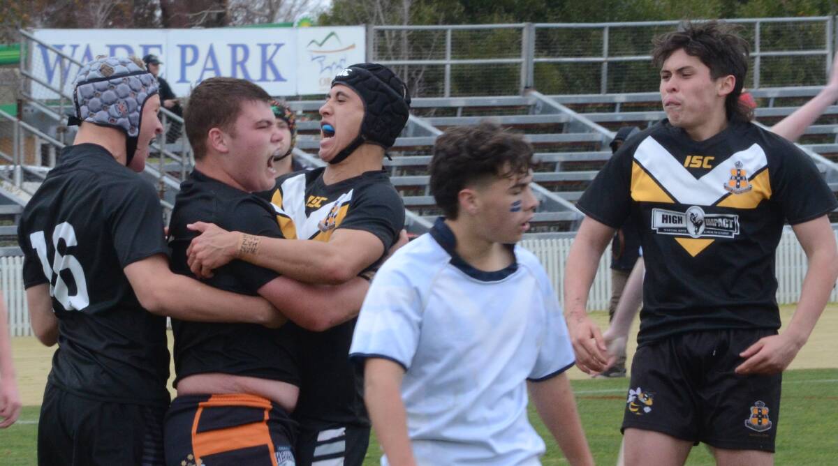 DELIGHT: Orange High School celebrate a try during their 30-20 victory over Bathurst on Friday. Photo: RILEY KRAUSE.