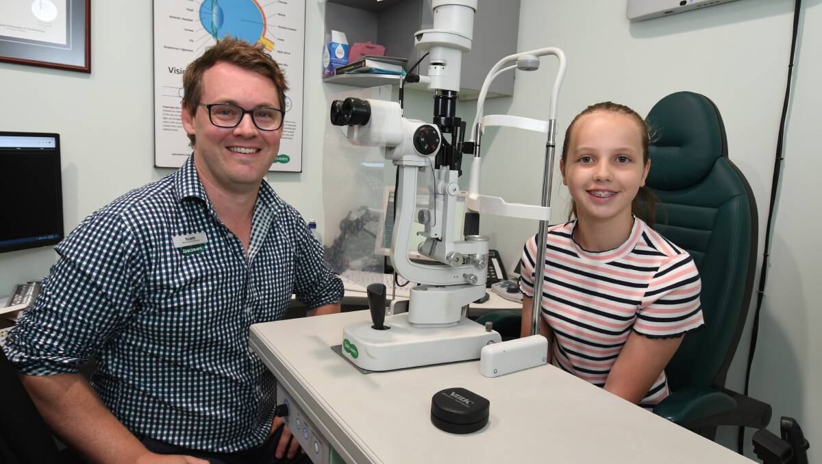 LOOKING GOOD: Scott Priddle is encouraging kids like Lucie Fowler to get their eyes checked before going back to school. Photo: JUDE KEOGH.