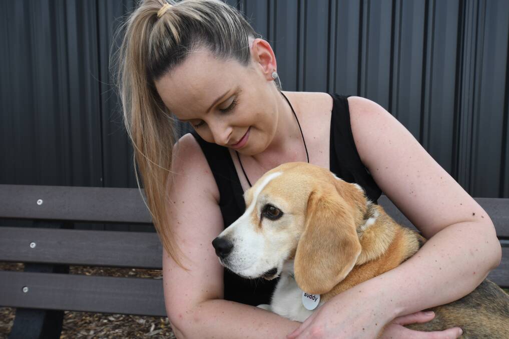 GOODBYE: Central West Animal Rescue's Jasmine Smart with a beagle named Buddy. Photo: CARLA FREEDMAN.