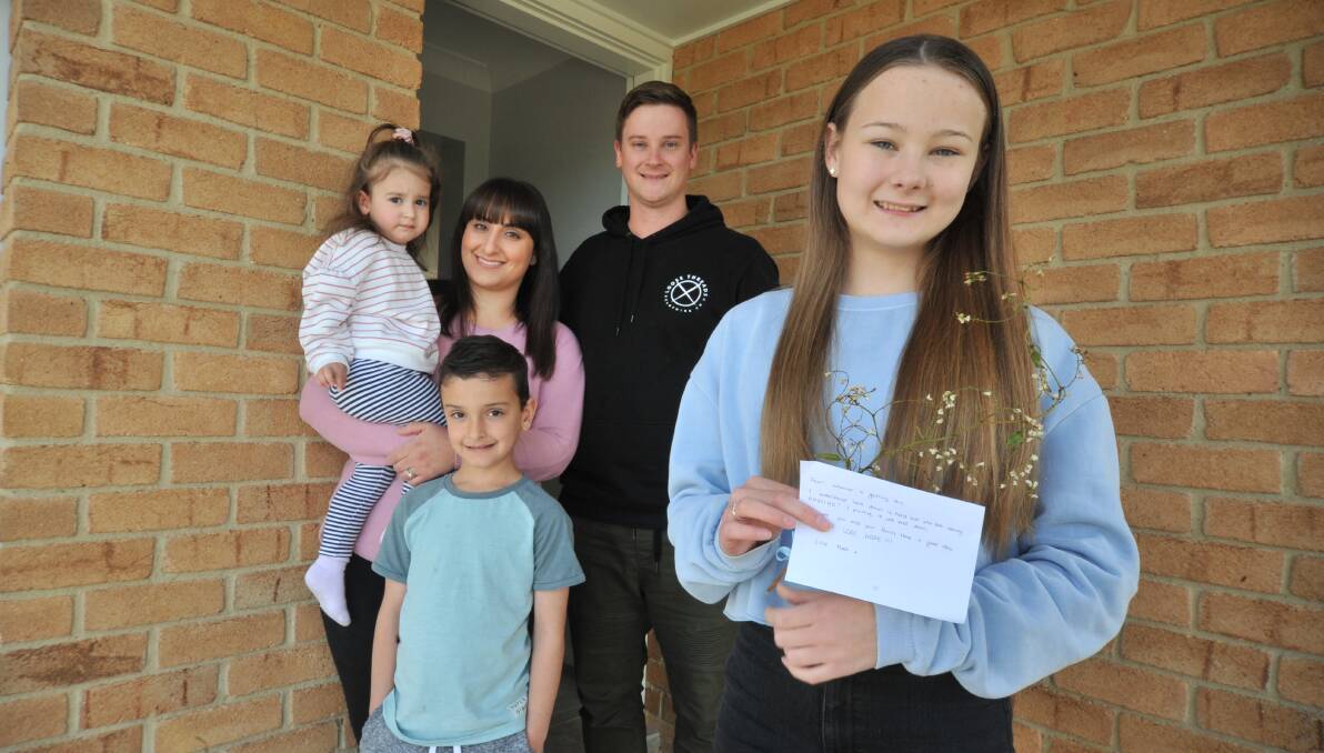 LOVELY IDEA: Lillia, Pina, Jackson, Adam and Annalise Bayliss were delighted to find the letter on their doorstep. Photo: JUDE KEOGH.
