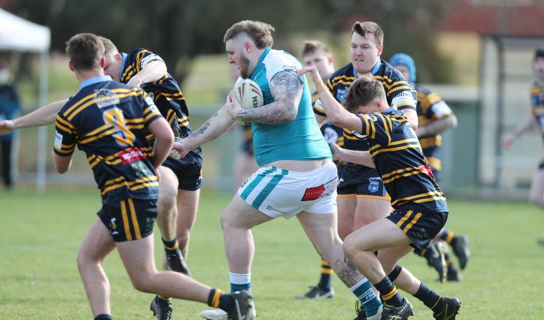 COMING THROUGH: Orange United prop Will Cusack charges at CSU's defence in last season's major semi-final. Photo: PHIL BLATCH 