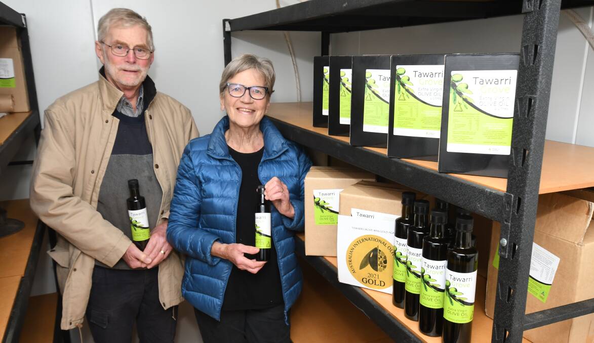 WINNERS: David and Rosslyn Kemp from Tawarri Grove won gold in the reserve champion mild extra virgin olive oil class. Photo: JUDE KEOGH.